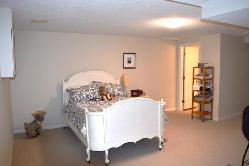 Unit 1 The lower level bedroom is it's own spacious ensuite with a 3/4 bath, plenty of storage and new carpet in 2023!