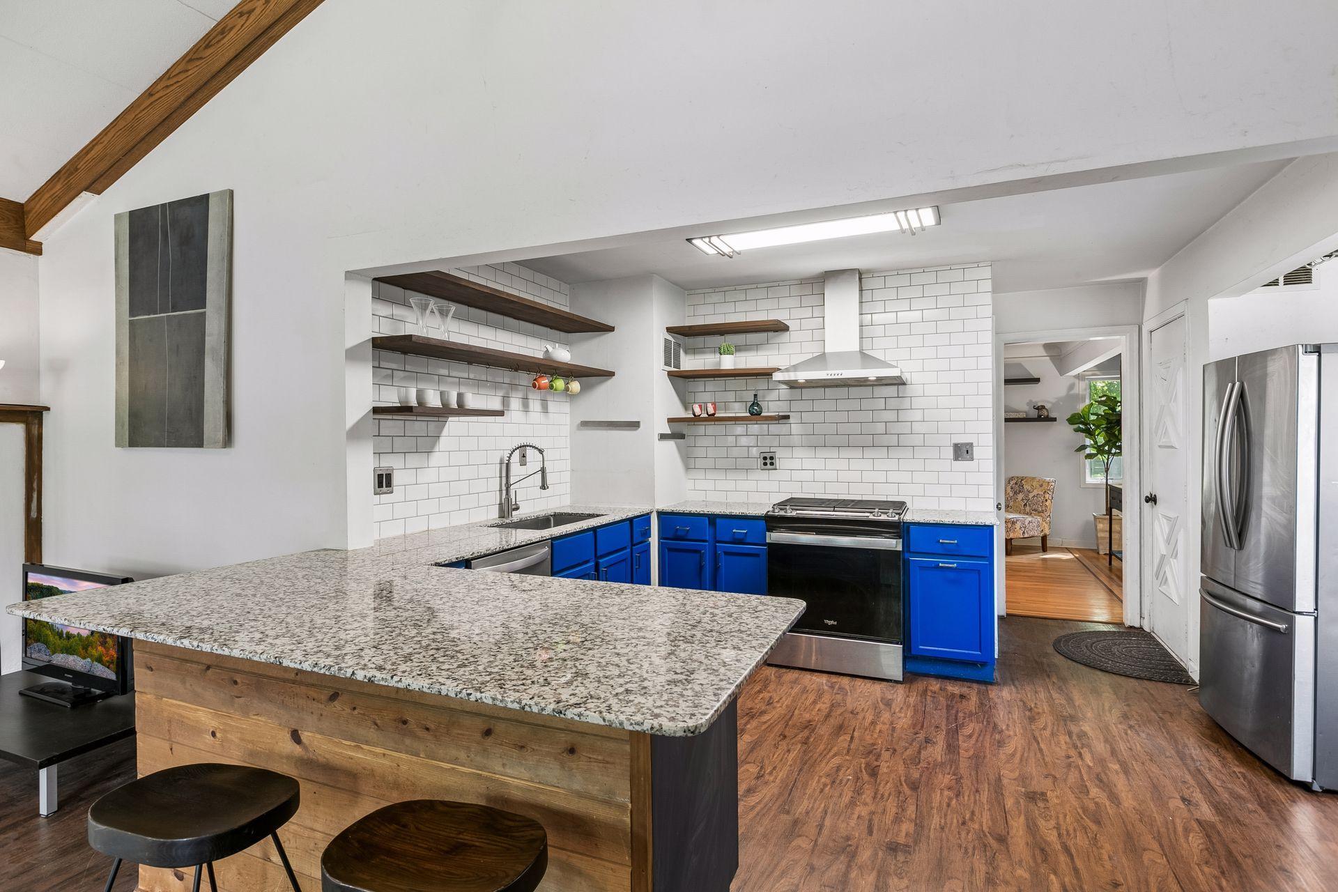 Kitchen with convenient breakfast bar.