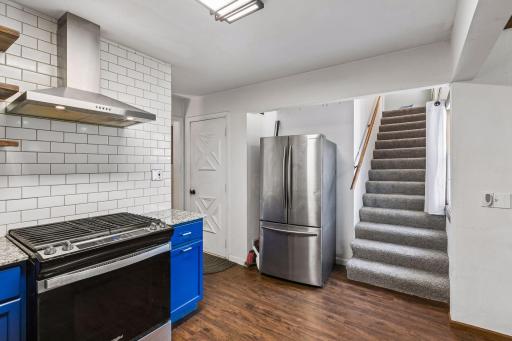 Door to garage off of kitchen with stairs to addition portion of the upstairs.