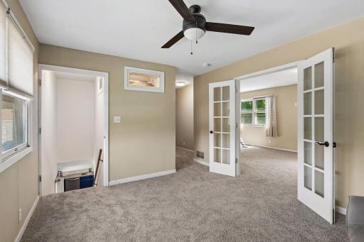 Lovely French doors lead to the primary bedroom.