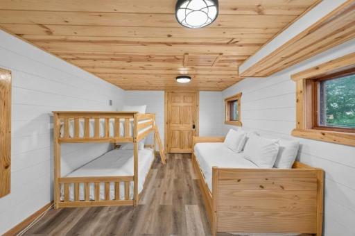 Lower level bunkroom. (Note: Bedding is AI generated.)