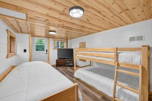 Lower level bunkroom. (Note: Bedding is AI generated.)