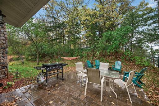 Patio area with fire pit overlooking the lake.