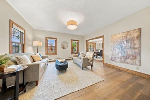 An inviting living room flows into the formal dining room.