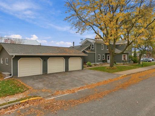 A heated, insulated 3-car detached garage adds versatility, while a new roof, siding, soffit, and fascia in 2018 offer added peace of mind.