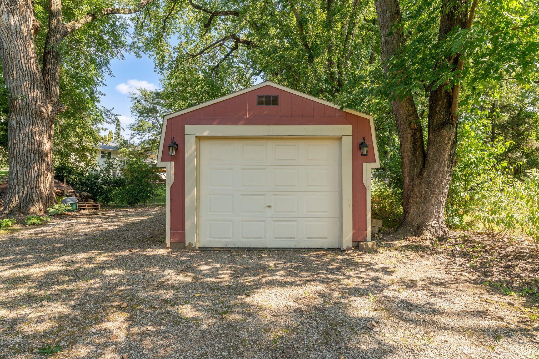 Bonus detached shed provides valuable extra storage with a convenient overhead door and easy access. Perfect for keeping lawn equipment, tools, recreational gear, and seasonal items organized and tucked away. Room to store your boat or camper too!
