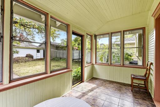 Step right off the kitchen out to the sunny east facing back porch