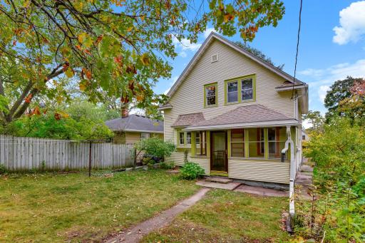 Fully fenced backyard is spacious and pleasant for relaxing, gardening, & more!