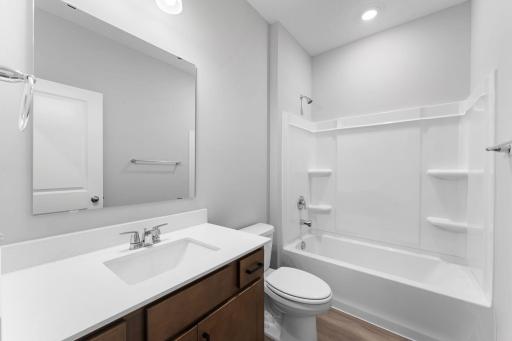 Main level full bath. Photo of actual home.