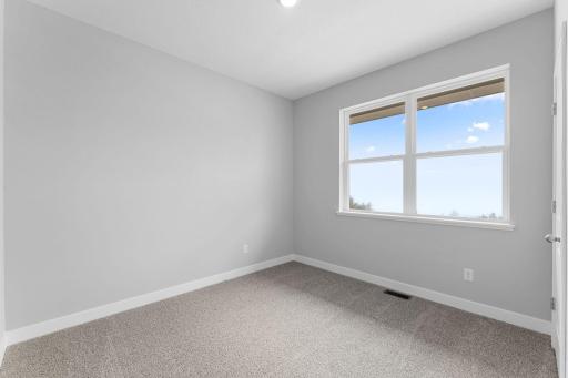 2nd of 4 main level bedrooms. Photo of actual home.
