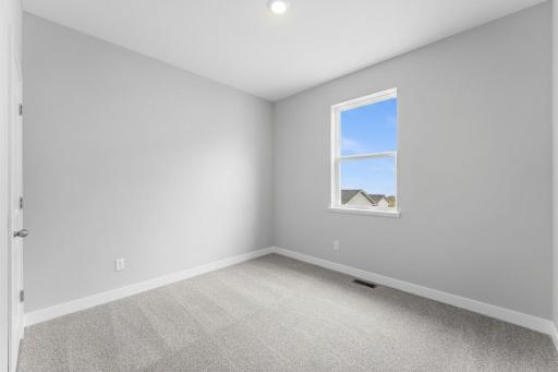 3rd of 4 main level bedrooms. Photo of actual home.