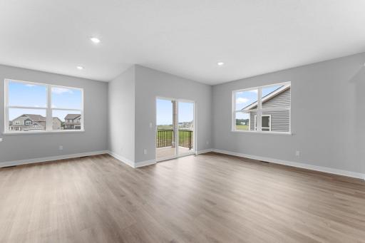 Sliding door from dining space will take you to a covered deck, included with the home! Photo of actual home.
