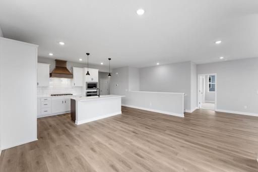 The Cali offers a spacious kitchen with island for seating. Photo of actual home.