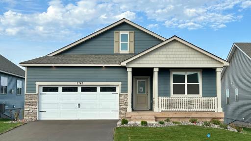 Welcome to the Cali at Bluff View in Shakopee! Top notch curb appeal with front porch entry and more. Welcome to one level living! Photo of actual home.