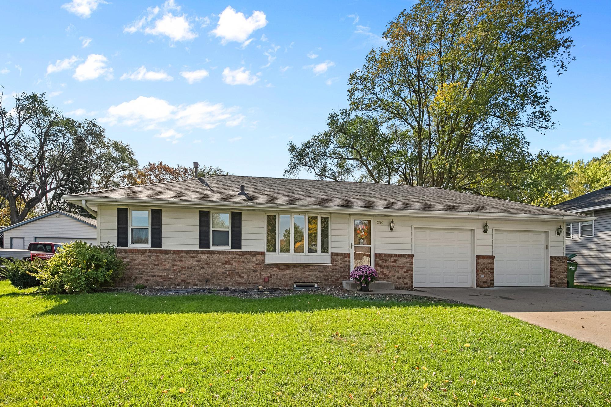 Welcome to 300 109th Ave NW -- a sweet 4 Bedroom Rambler with oversized Double Garage loaded with extras!