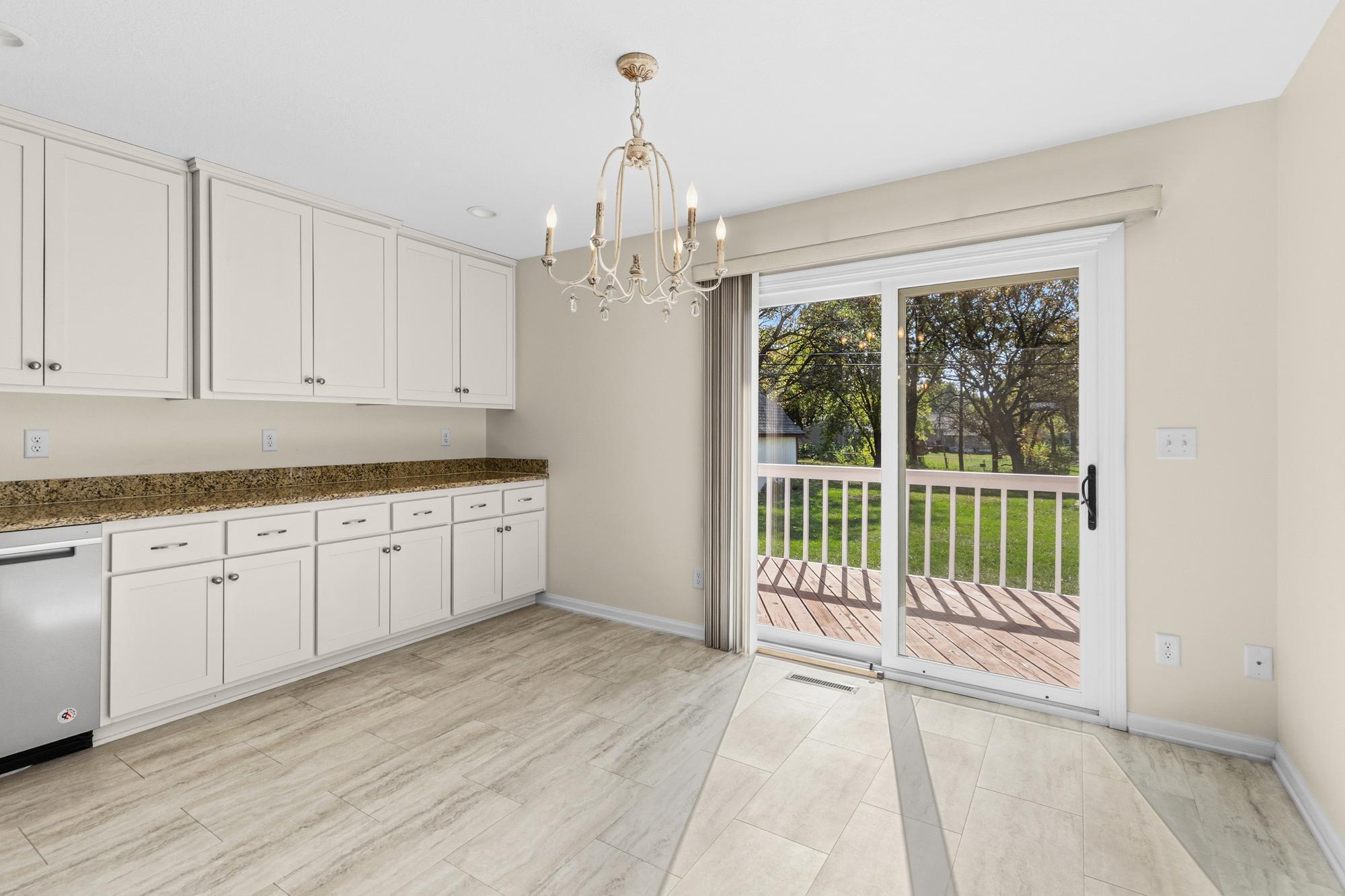 More storage and work space in this Amazing Kitchen with sliding glass door to the Decks and backyard.