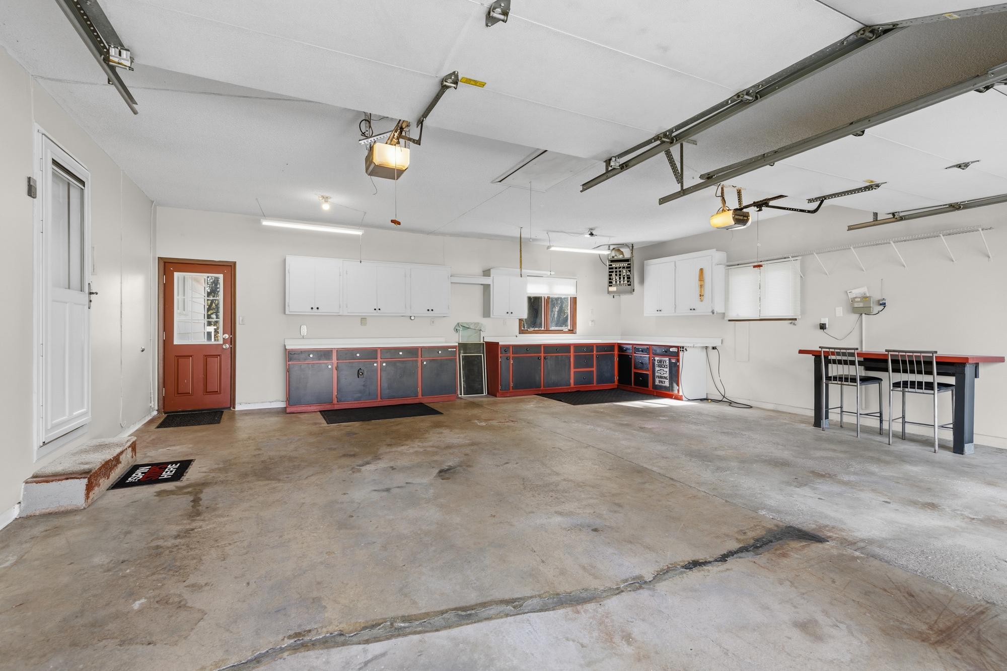 DREAM GARAGE: Insulated walls and doors, sheet rocked, gas heated, with 2 electric garage dooor openers and a lighted attic with a pull-down door access.
