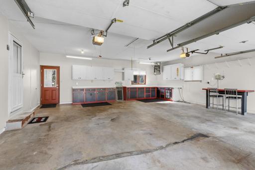 DREAM GARAGE: Insulated walls and doors, sheet rocked, gas heated, with 2 electric garage dooor openers and a lighted attic with a pull-down door access.