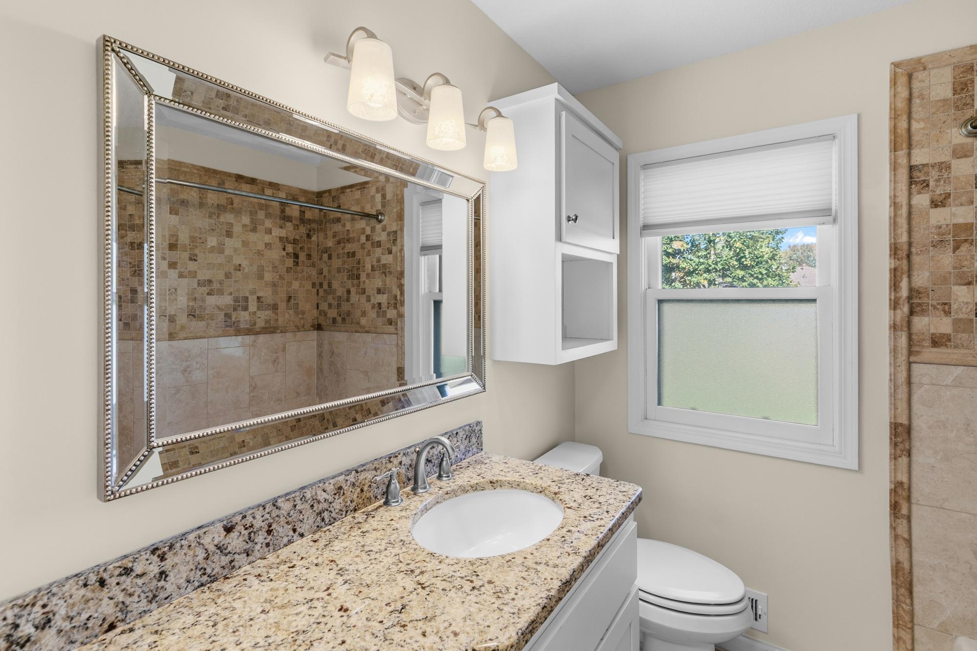 Remodeled main floor Bath with Granite counter.