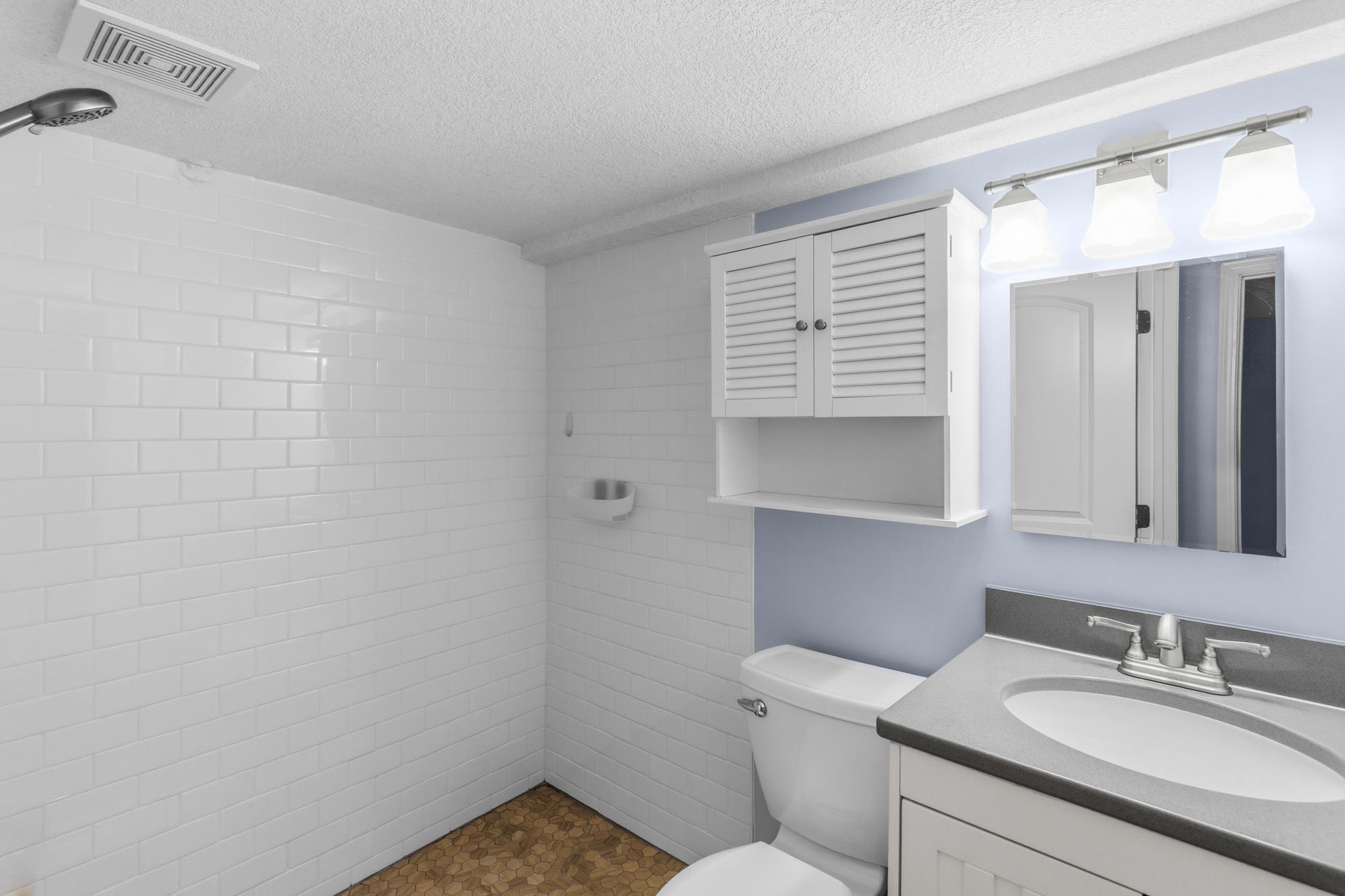 Solid surface counter in lower level Bath.