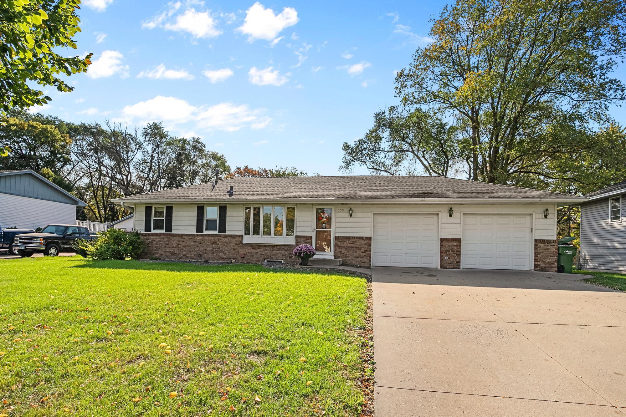 Brick and aluminum for a maintenance-free exterior plus a Concrete Driveway.