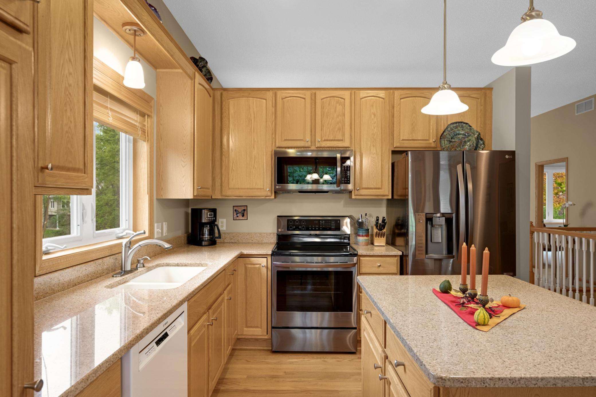 Granite countertops, stainless steel appliances and a Bosch dishwasher highlight this Kitchen. The window above the sink provides natural light while preparing meals or cleaning up.
