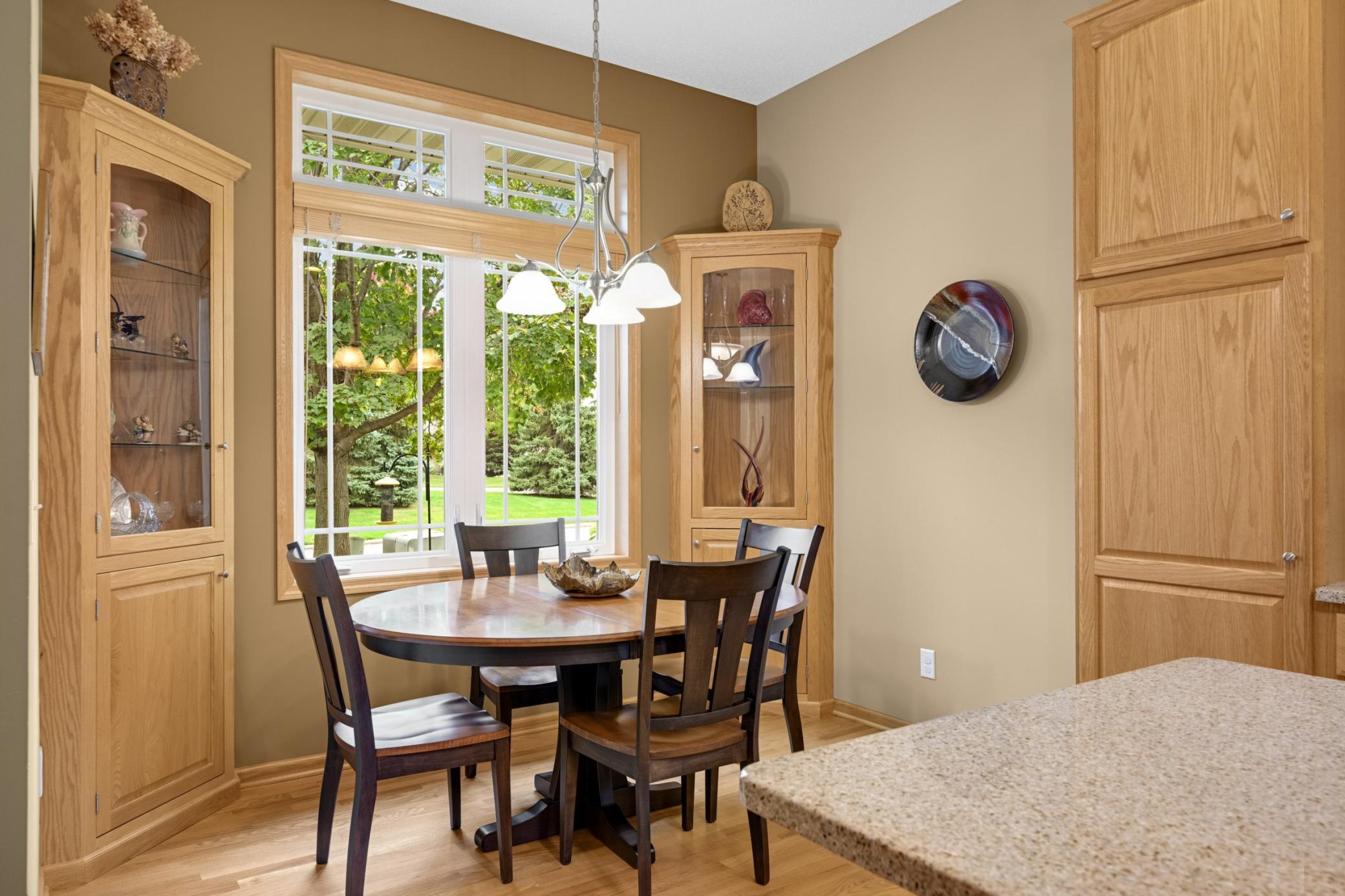 The Dinette offers a comfortable spot for morning coffee or casual meals, with a large window, transom above and built-in corner cabinets for displaying favorite pieces.