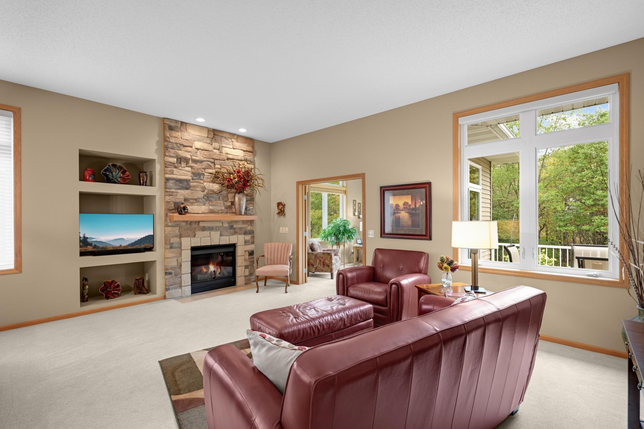 Enjoy the warmth of the Gas Fireplace while taking in the beautiful wooded surroundings through the large windows. The adjoining Sunroom adds even more space to relax and enjoy the natural setting.
