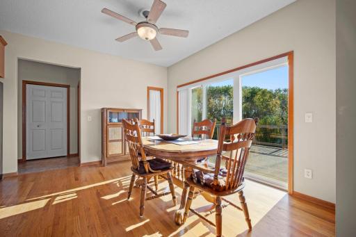 The spacious dining area opens through patio doors to the deck, making it easy to enjoy indoor-outdoor dining and entertaining.