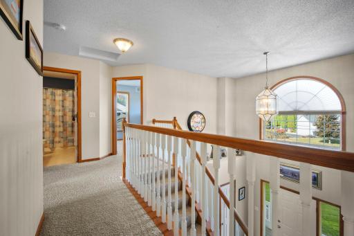 The upper level features all four bedrooms, with plenty of windows that fill the spaces with natural light.