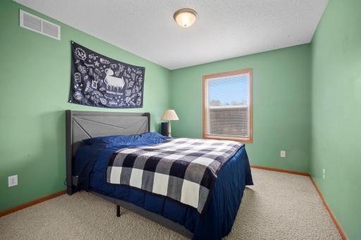 The upper level also includes a third bedroom.