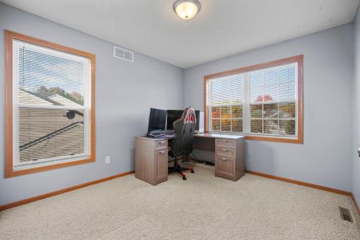 The upper level also includes a fourth bedroom.