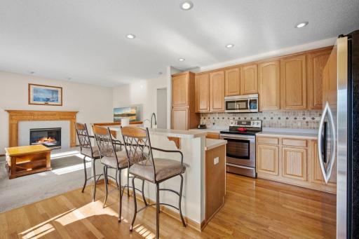 The kitchen features a center island with a breakfast counter and a newer built-in double sink, complemented by a reverse osmosis water system.