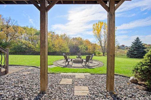 The walkout patio door opens to the backyard, with access to the deck and paver fire pit.