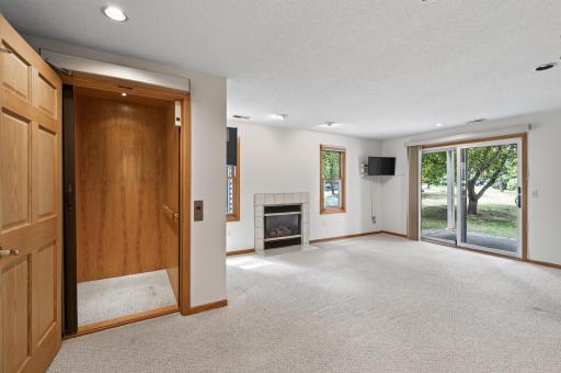 Elevator comes down to lower level cozy family room!