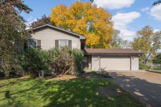 Welcome home! Inviting split-level home with mature trees and an attached two-car garage.