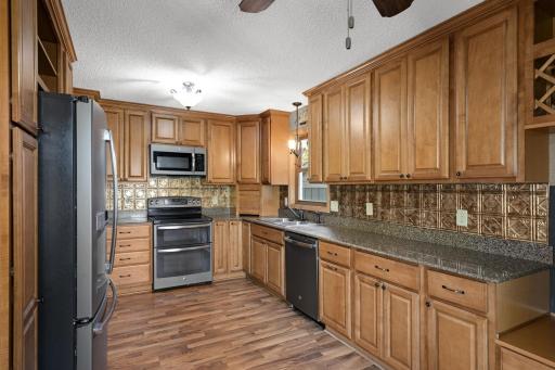 Updated kitchen with abundant cabinetry, generous counter space and stainless steel appliances.