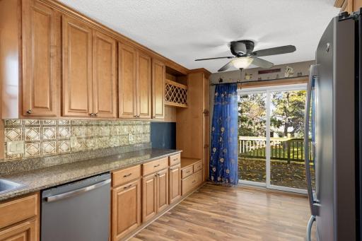 Kitchen and dining area with sliding glass doors leading to the outdoor deck.