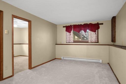 Another view of the lower-level living area with convenient access to adjoining rooms.