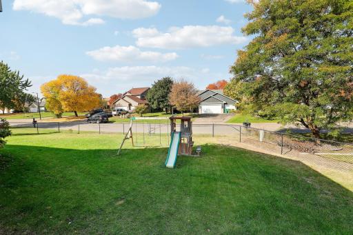 Fenced back yard with plenty of room for gardens, a firepit, and play area.