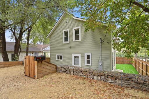 Convenient backyard gravel parking pad offers additional off-street parking!