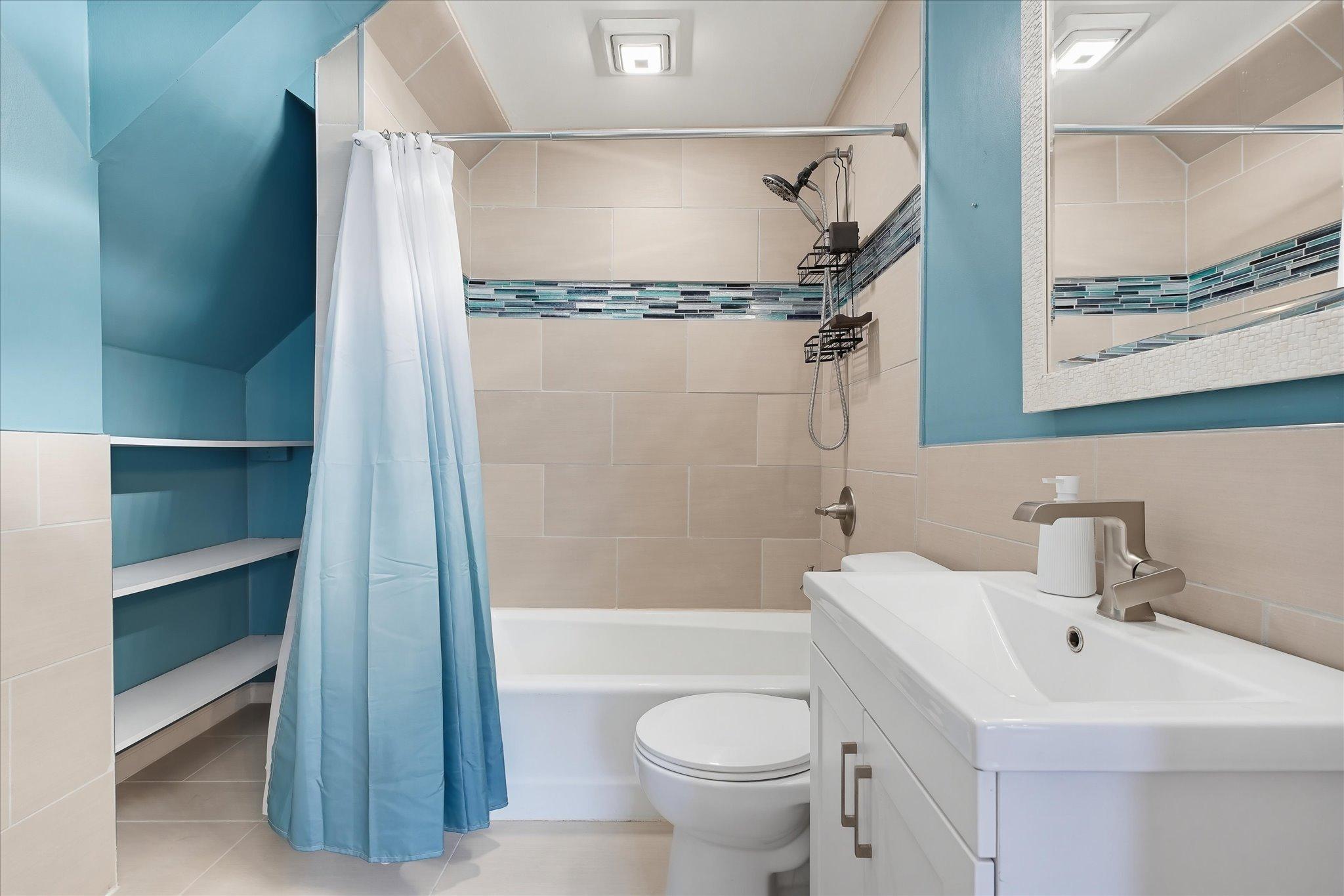 Remodeled bathroom blends modern updates with the home’s classic style!