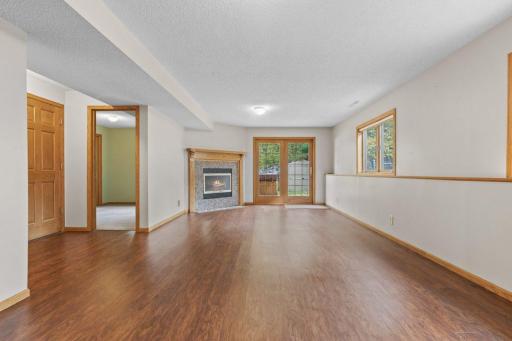 lower level living room with gas fireplace and walk-out