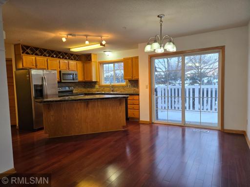 Cherry hardwood floors and sliding double doors off the Dining room lead to patio area