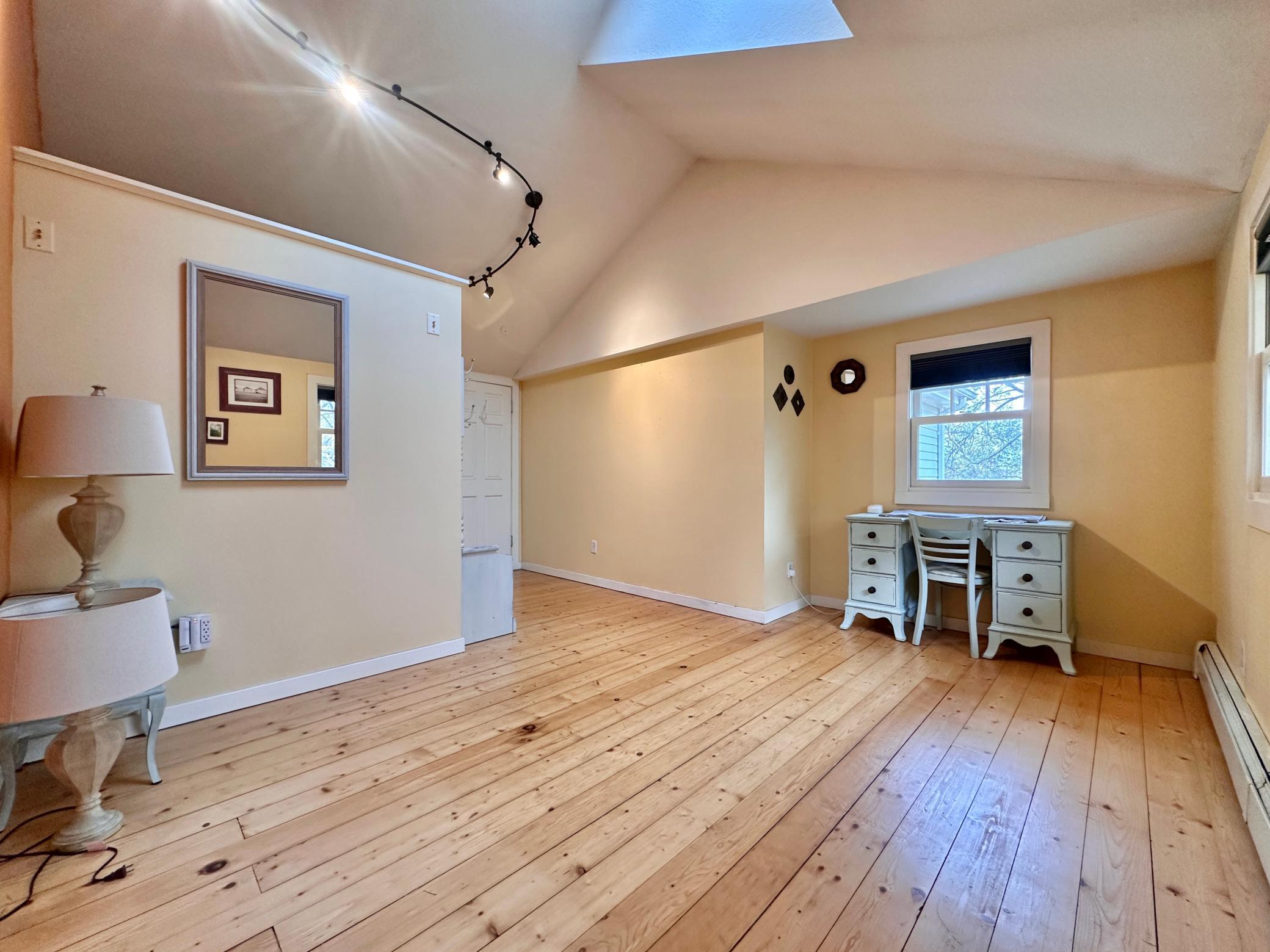 Another look at this great room with wood floors that run through the upper level.