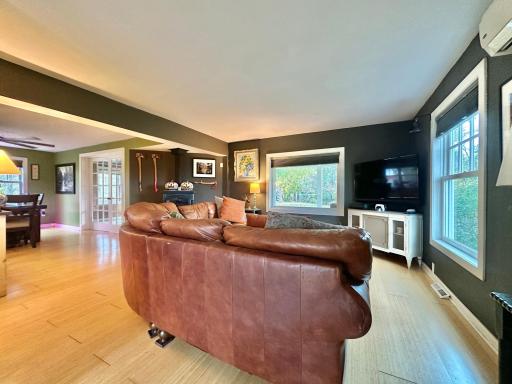 What is great here is the open floor plan and bamboo flooring that brightens the room.