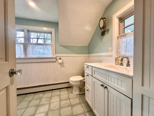 The upstairs bath is full of windows and flooded with natural light.