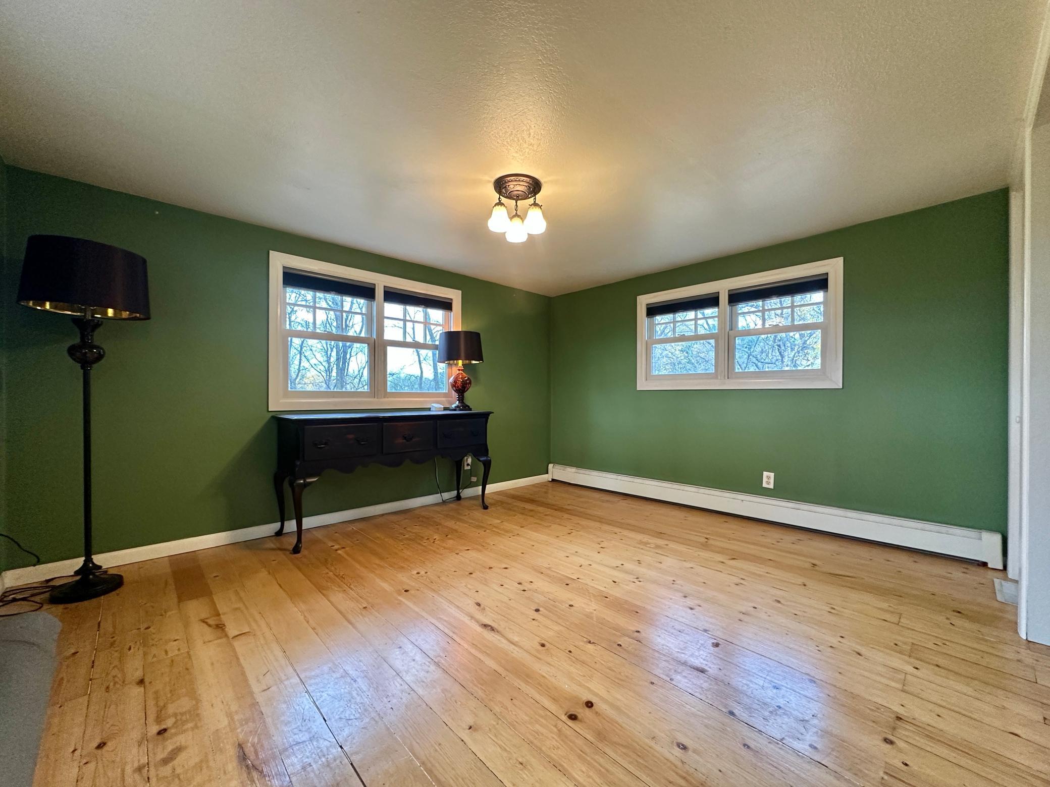 Again wood floors, double window for great lighting, and hot water boiler heat for comfort.