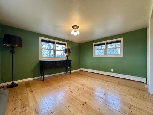 Again wood floors, double window for great lighting, and hot water boiler heat for comfort.
