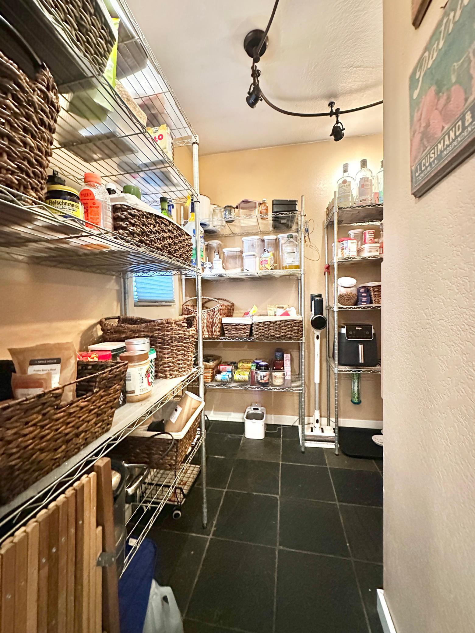 The cook of the house will LOVE this huge pantry space to hide your extras and big appliances.